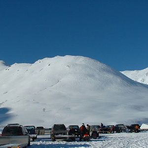 See the skiers walking up the face