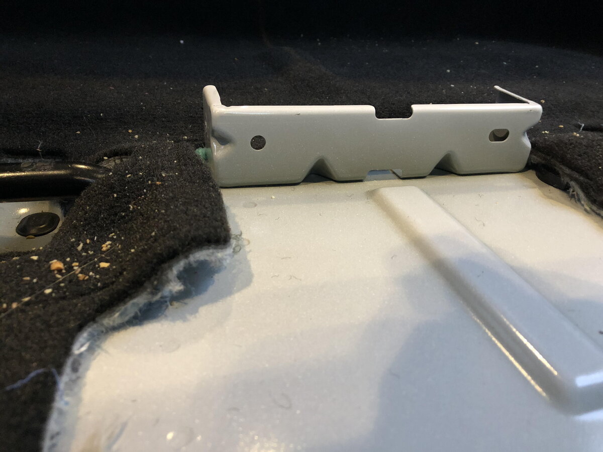 Factory Console rear install bracket.jpg