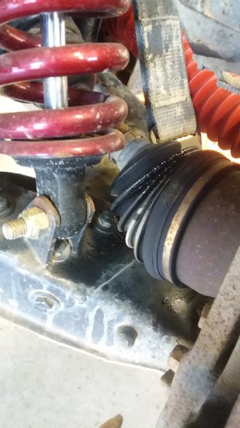 P side cv boot tear outer.jpg