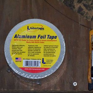 Aluminum foil tape & a box cutter.
