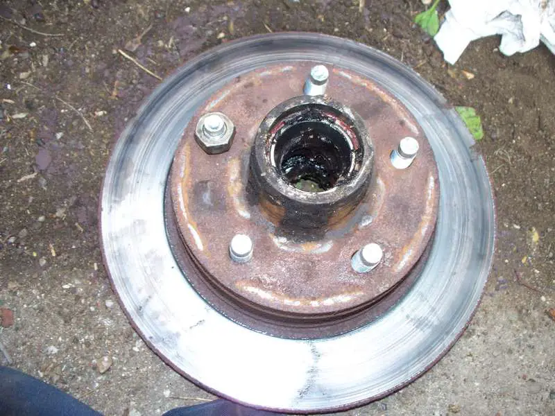 A wheel nut (lug nut) pulls the stud into position.