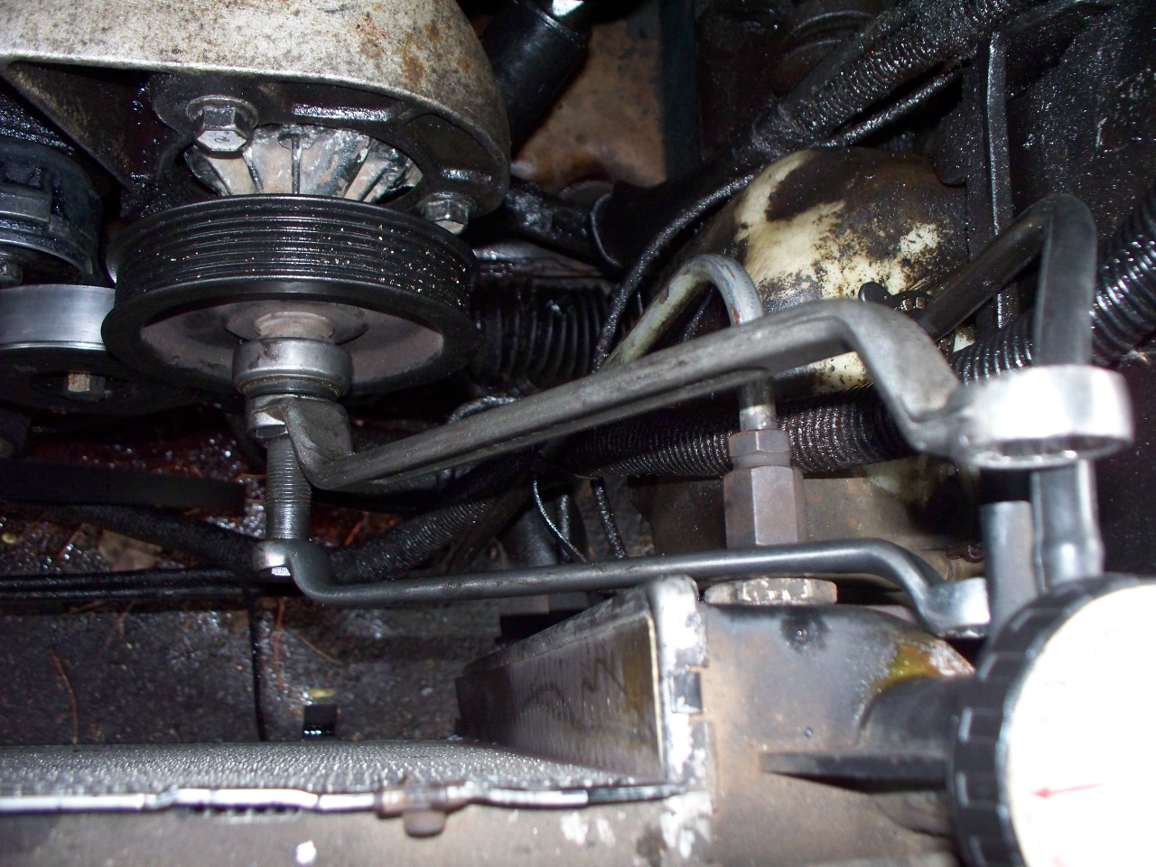 Hold the outer wrench while tightening the inner nut.