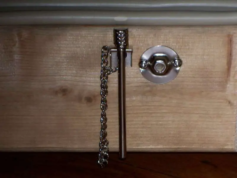 The locking pin in its holder.